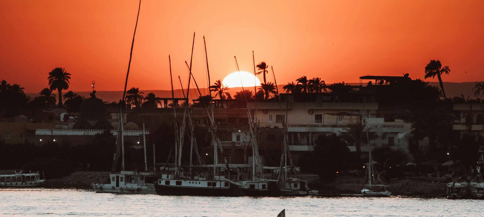 The sun setting over a fishing community in East Africa
